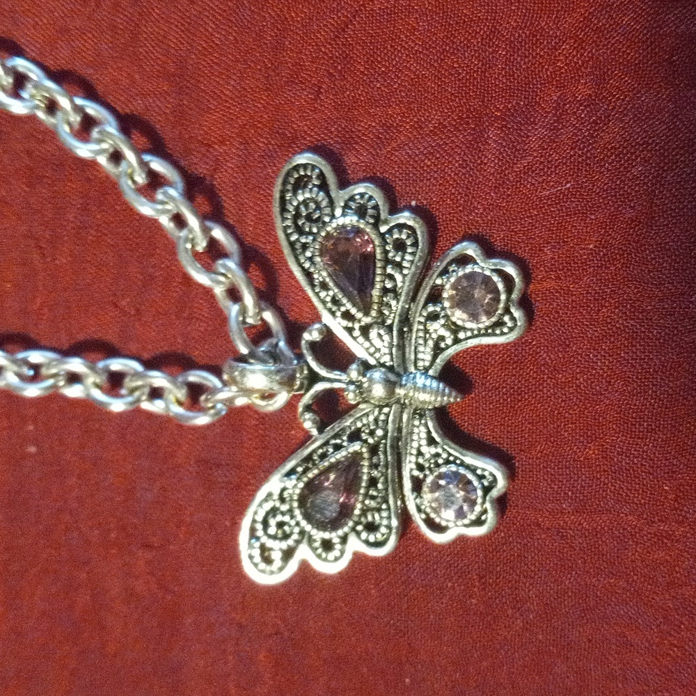 Amethyst crystal butterfly pendent on a 18 inch circle link chain toggle clasp